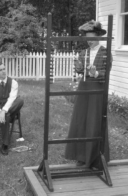 It looks like it is around the year 1910. A woman (who looks a lot like Emily) is explaining how to use an abacus, while a well-dressed man sits on a chair and watches.